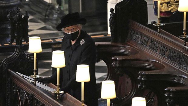 Britain's Queen Elizabeth II in St. George’s Chapel during the funeral of Prince Philip, the man who had been by her side for 73 years, at Windsor Castle, Windsor, England, Saturday April 17, 2021. Prince Philip died April 9 at the age of 99 after 73 years of marriage to Britain's Queen Elizabeth II. (Yui Mok/Pool via AP)