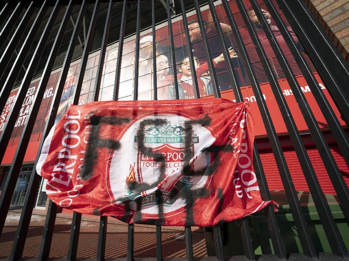 Banners are seen outside Liverpool's Anfield Stadium protesting the formation of the European Super League, Liverpool, England, Monday, April 19, 2021. Players at the 12 clubs setting up their own Super League could be banned from this year's European Championship and next year's World Cup, UEFA President Aleksander Ceferin said Monday.