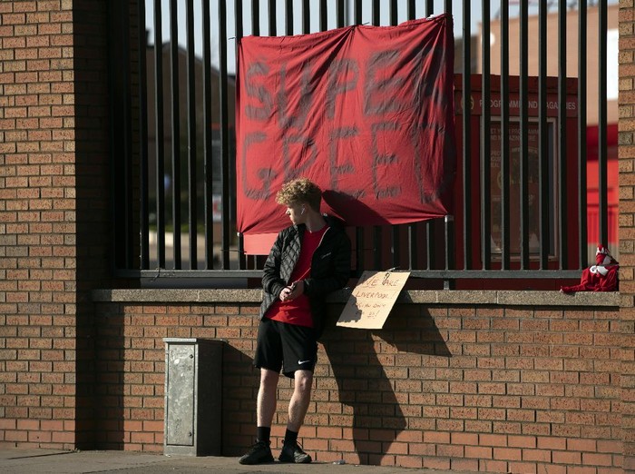 Banners are seen outside Liverpool's Anfield Stadium protesting the formation of the European Super League, Liverpool, England, Monday, April 19, 2021. Players at the 12 clubs setting up their own Super League could be banned from this year's European Championship and next year's World Cup, UEFA President Aleksander Ceferin said Monday.
