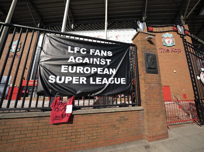 Banners are seen outside Liverpool's Anfield Stadium protesting the formation of the European Super League, Liverpool, England, Monday, April 19, 2021. Players at the 12 clubs setting up their own Super League could be banned from this year's European Championship and next year's World Cup, UEFA President Aleksander Ceferin said Monday.