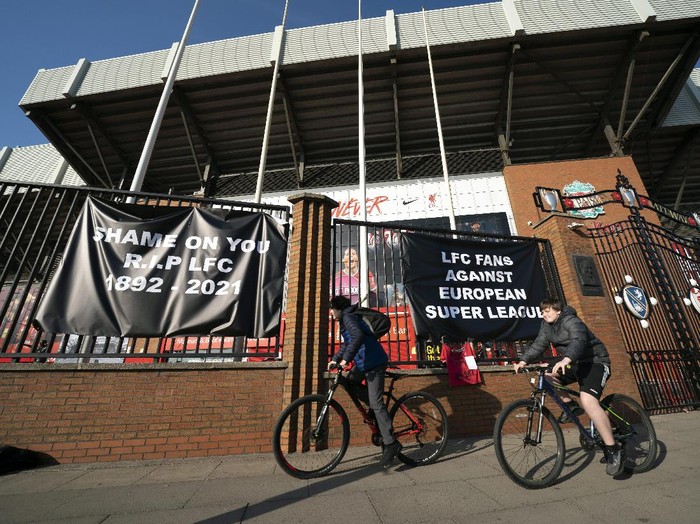 Banners are seen outside Liverpool's Anfield Stadium protesting the formation of the European Super League, Liverpool, England, Monday, April 19, 2021. Players at the 12 clubs setting up their own Super League could be banned from this year's European Championship and next year's World Cup, UEFA President Aleksander Ceferin said Monday.