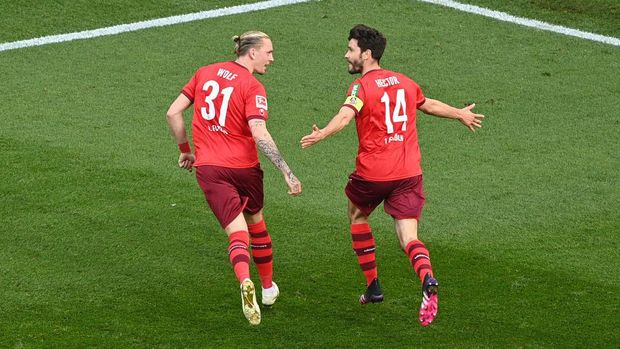 COLOGNE, GERMANY - APRIL 20: Jonas Hector of 1.FC Koeln  celebrates with Marius Wolf after scoring their team's second goal  during the Bundesliga match between 1. FC Koeln and RB Leipzig at RheinEnergieStadion on April 20, 2021 in Cologne, Germany. Sporting stadiums around Germany remain under strict restrictions due to the Coronavirus Pandemic as Government social distancing laws prohibit fans inside venues resulting in games being played behind closed doors. (Photo by Lukas Schulze/Getty Images)