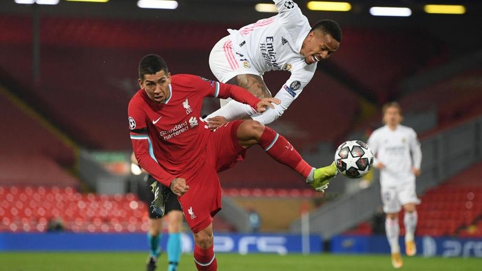 MADRID, SPAIN - APRIL 06: Eder Gabriel Militao of Real Madrid CF reacts during the UEFA Champions League Quarter Final match between Real Madrid and Liverpool FC at Estadio Alfredo Di Stefano on April 06, 2021 in Madrid, Spain. Sporting stadiums around Spain remain under strict restrictions due to the Coronavirus Pandemic as Government social distancing laws prohibit fans inside venues resulting in games being played behind closed doors. (Photo by Gonzalo Arroyo Moreno/Getty Images)