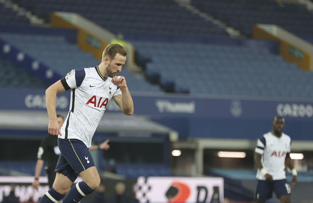 Tottenham's Harry Kane celebrates after scoring his side's second goal during the English Premier League soccer match between Everton and Tottenham Hotspur at Goodison Park in Liverpool, England, Friday, April 16, 2021. (Clive Brunskill/Pool via AP)