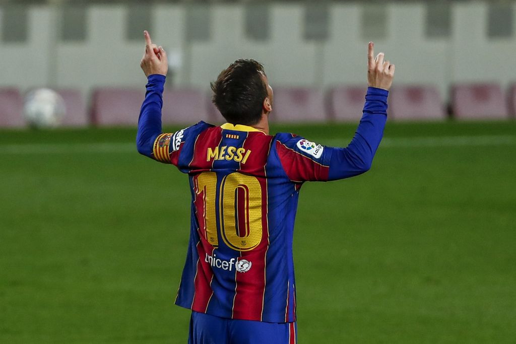 Barcelona's Lionel Messi celebrates after scoring the opening goal during the Spanish La Liga soccer match between FC Barcelona and Getafe at the Camp Nou stadium in Barcelona, Spain, Thursday, April 22, 2021. (AP Photo/Joan Monfort)