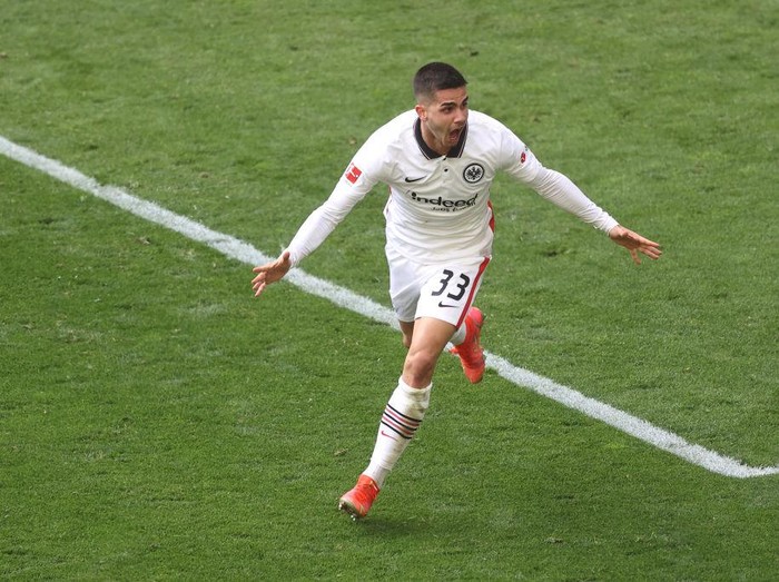 DORTMUND, GERMANY - APRIL 03: Andre Silva of Eintracht Frankfurt celebrates after scoring their side's second goal as during the Bundesliga match between Borussia Dortmund and Eintracht Frankfurt at Signal Iduna Park on April 03, 2021 in Dortmund, Germany. Sporting stadiums around Germany remain under strict restrictions due to the Coronavirus Pandemic as Government social distancing laws prohibit fans inside venues resulting in games being played behind closed doors. (Photo by Lars Baron/Getty Images)