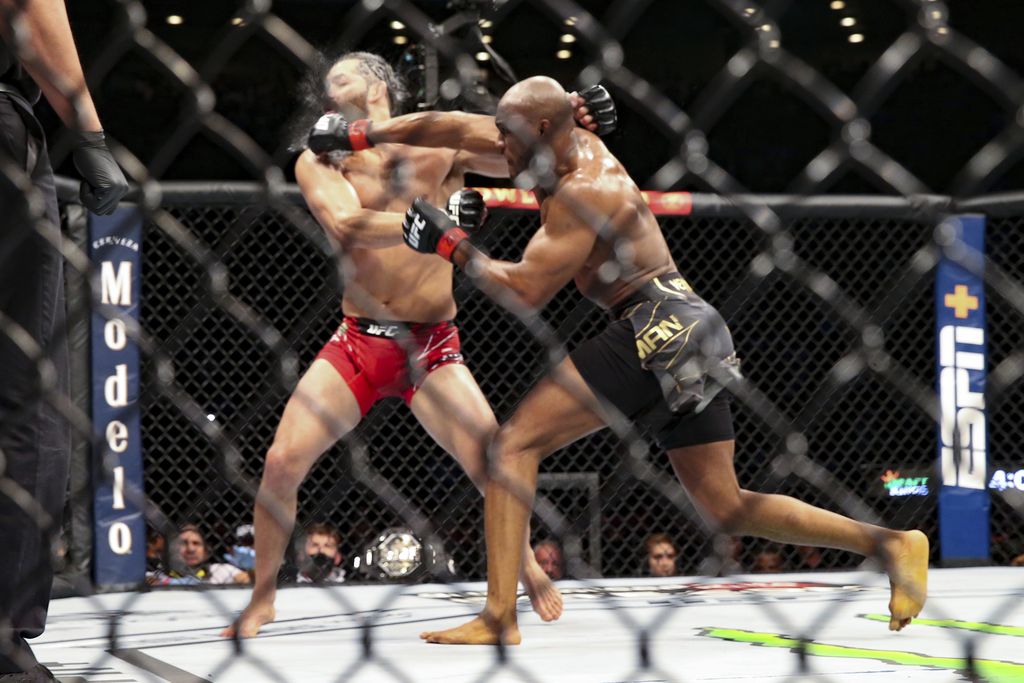 Kamaru Usman knocks out Jorge Masvidal during a UFC 261 mixed martial arts bout early Sunday, April 25, 2021, in Jacksonville, Fla.  (AP Photo/Gary McCullough)