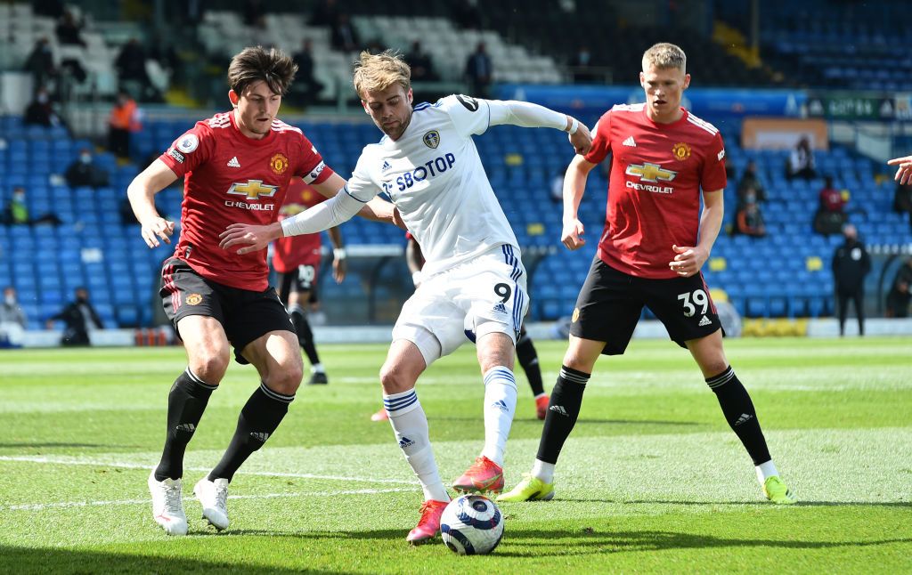 LEEDS, ENGLAND - APRIL 25: Mason Greenwood of Manchester United is challenged by Pascal Struijk of Leeds United during the Premier League match between Leeds United and Manchester United at Elland Road on April 25, 2021 in Leeds, England. Sporting stadiums around the UK remain under strict restrictions due to the Coronavirus Pandemic as Government social distancing laws prohibit fans inside venues resulting in games being played behind closed doors. (Photo by Laurence Griffiths/Getty Images)