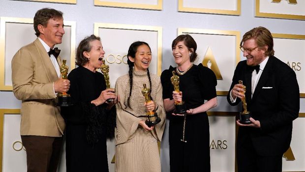 Producers Peter Spears, from left, Frances McDormand, Chloe Zhao, Mollye Asher and Dan Janvey, winners of the award for best picture for 