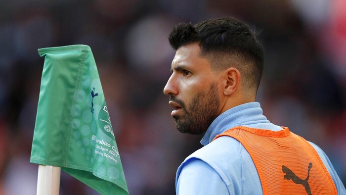 Manchester Citys Sergio Aguero warms up by the touchline during the English League Cup final soccer match between Manchester City and Tottenham Hotspur at Wembley stadium in London, Sunday, April 25, 2021. (AP Photo/Alastair Grant)