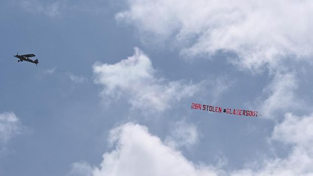 LEEDS, ENGLAND - APRIL 25: A Plane with a banner that reads 