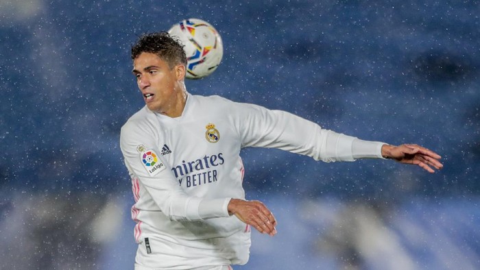 Real Madrids Raphael Varane heads for the ball during the Spanish La Liga soccer match between Real Madrid and Betis at the Alfredo di Stefano stadium in Madrid, Spain, Saturday, April 24, 2021. (AP Photo/Bernat Armangue)