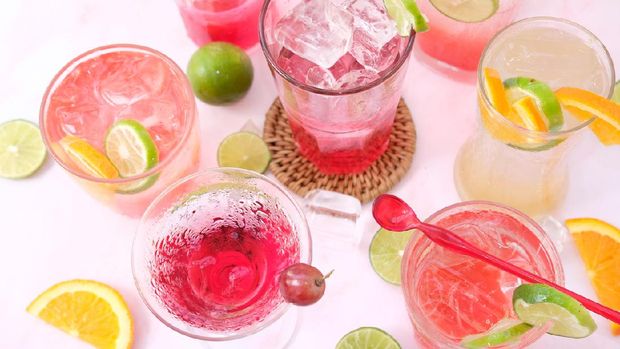 Top view fruit punch mocktails on white background