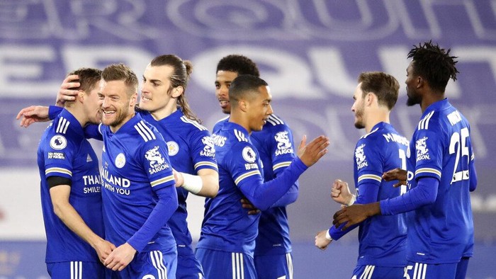 Leicester City players celebrate after Leicesters Timothy Castagne, left, scored his sides opening goal during the English Premier League soccer match between Leicester City and Crystal Palace at the King Power Stadium in Leicester, England, Monday, April 26, 2021. (Alex Pantling/Pool via AP)
