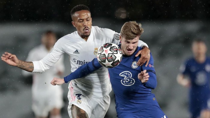Chelseas Timo Werner vies for the ball with Real Madrids Eder Militao, left, during the Champions League semifinal first leg soccer match between Real Madrid and Chelsea at the Alfredo di Stefano stadium in Madrid, Spain, Tuesday, April 27, 2021. (AP Photo/Bernat Armangue)