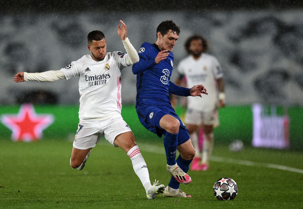 MADRID, SPAIN - APRIL 27 Eden Hazard of Real Madrid battles for possession with Andreas Christensen of Chelsea during the UEFA Champions League Semi Final First Leg match between Real Madrid and Chelsea FC at Estadio Alfredo Di Stefano on April 27, 2021 in Madrid, Spain. Sporting stadiums around Spain remain under strict restrictions due to the Coronavirus Pandemic as Government social distancing laws prohibit fans inside venues resulting in games being played behind closed doors.  (Photo by Denis Doyle/Getty Images)