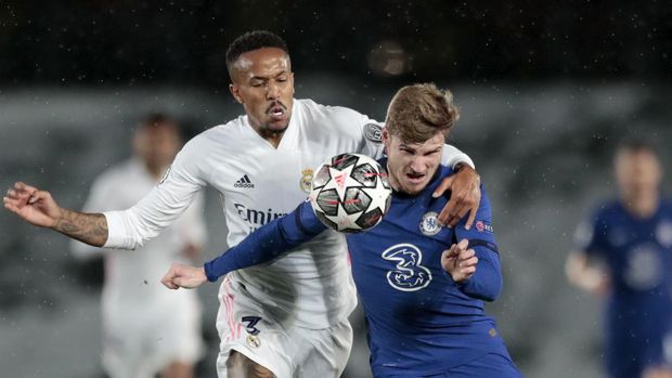 Chelsea's Timo Werner vies for the ball with Real Madrid's Eder Militao, left, during the Champions League semifinal first leg soccer match between Real Madrid and Chelsea at the Alfredo di Stefano stadium in Madrid, Spain, Tuesday, April 27, 2021. (AP Photo/Bernat Armangue)