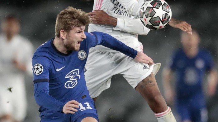Chelseas Timo Werner vies for the ball with Real Madrids Eder Militao, right, during the Champions League semifinal first leg soccer match between Real Madrid and Chelsea at the Alfredo di Stefano stadium in Madrid, Spain, Tuesday, April 27, 2021. (AP Photo/Bernat Armangue)