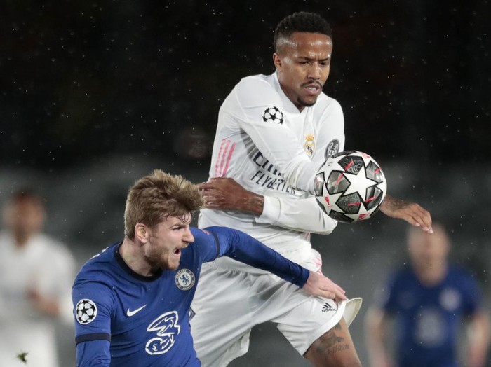 Chelseas Timo Werner vies for the ball with Real Madrids Eder Militao, right, during the Champions League semifinal first leg soccer match between Real Madrid and Chelsea at the Alfredo di Stefano stadium in Madrid, Spain, Tuesday, April 27, 2021. (AP Photo/Bernat Armangue)