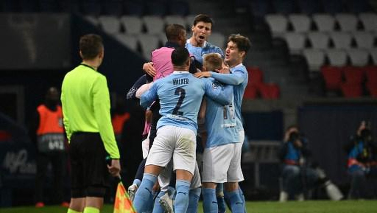 Man City berhasil menumbangkan PSG. Foto: AFP/ANNE-CHRISTINE POUJOULAT