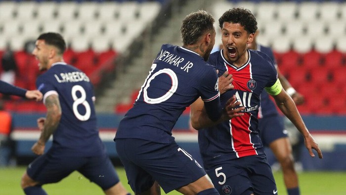 PSGs Marquinhos, right, celebrates with PSGs Neymar after scoring his sides first goal during the Champions League semifinal first leg soccer match between Paris Saint Germain and Manchester City at the Parc des Princes stadium, in Paris, France , Wednesday, April 28, 2021. (AP Photo/Thibault Camus)