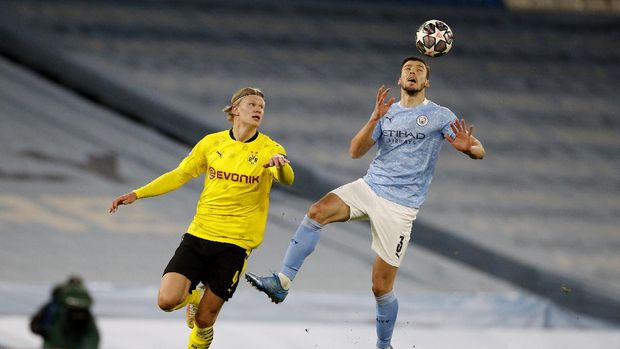 Soccer Football - Champions League - Quarter Final - First Leg - Manchester City v Borussia Dortmund - Etihad Stadium, Manchester, Britain - April 6, 2021 Manchester City's Ruben Dias in action with Borussia Dortmund's Erling Braut Haaland REUTERS/Phil Noble