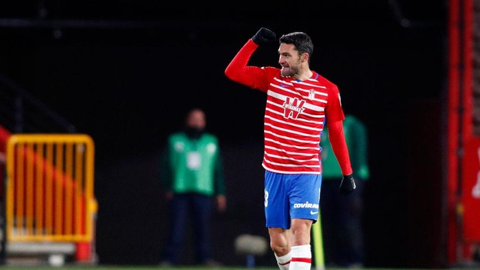 GRANADA, SPAIN - DECEMBER 30: Jorge Molina of Granada CF celebrates after scoring his sides second goal during the La Liga Santander match between Granada CF and Valencia CF at Estadio Nuevo Los Carmenes on December 30, 2020 in Granada, Spain. Sporting stadiums around Spain remain under strict restrictions due to the Coronavirus Pandemic as Government social distancing laws prohibit fans inside venues resulting in games being played behind closed doors. (Photo by Fran Santiago/Getty Images)