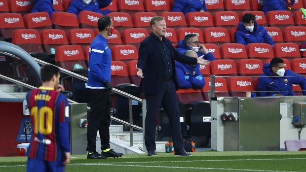 Barcelona's head coach Ronald Koeman gestures during the Spanish La Liga soccer match between FC Barcelona and Granada at the Camp Nou stadium in Barcelona, Spain, Thursday, April 29, 2021. (AP Photo/Joan Monfort)