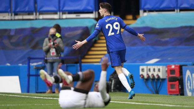 Chelsea's Kai Havertz celebrates after scoring his side's opening goal during the English Premier League soccer match between Chelsea and Fulham at Stamford Bridge Stadium in London, Saturday, May 1, 2021. (AP Photo/Ian Walton, Pool)