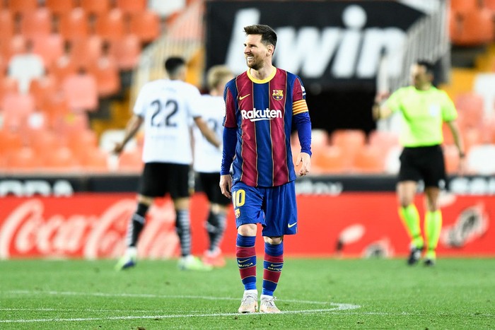 VALENCIA, SPAIN - MAY 02: Lionel Messi of FC Barcelona reacts after scoring their sides first goal during the La Liga Santander match between Valencia CF and FC Barcelona at Estadio Mestalla on May 02, 2021 in Valencia, Spain. Sporting stadiums around Spain remain under strict restrictions due to the Coronavirus Pandemic as Government social distancing laws prohibit fans inside venues resulting in games being played behind closed doors. (Photo by Aitor Alcalde/Getty Images)