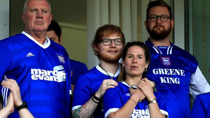 IPSWICH, ENGLAND - APRIL 21:  Musician Ed Sheeran and fiance Cherry Seaborn look on during the Sky Bet Championship match between Ipswich Town and Aston Villa at Portman Road on April 21, 2018 in Ipswich, England. (Photo by Stephen Pond/Getty Images)