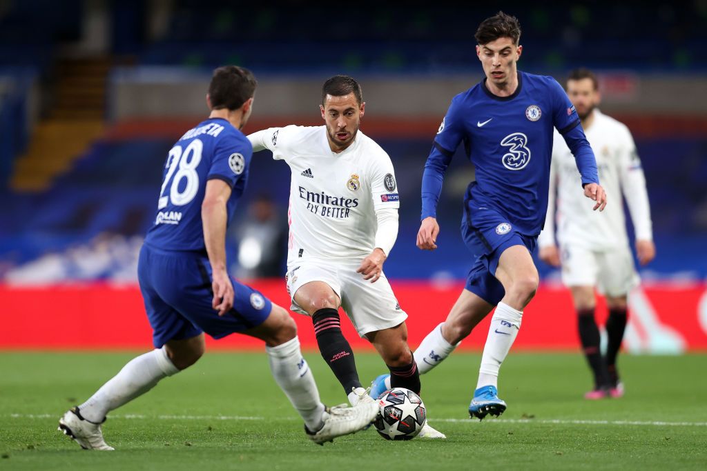 LONDON, ENGLAND - MAY 05: Eden Hazard of Real Madrid is closed down by Cesar Azpilicueta and Kai Havertz of Chelsea during the UEFA Champions League Semi Final Second Leg match between Chelsea and Real Madrid at Stamford Bridge on May 05, 2021 in London, England. Sporting stadiums around Europe remain under strict restrictions due to the Coronavirus Pandemic as Government social distancing laws prohibit fans inside venues resulting in games being played behind closed doors. (Photo by Clive Rose/Getty Images)