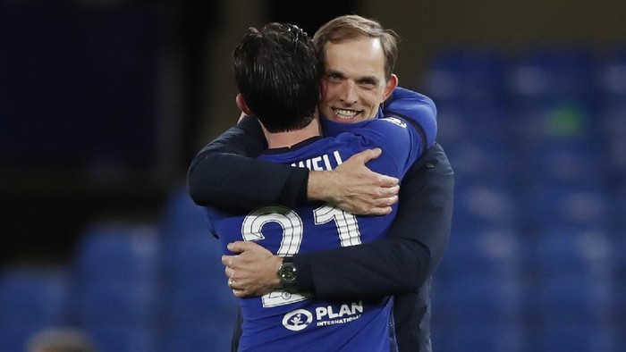 Chelseas head coach Thomas Tuchel celebrates with Ben Chilwell at the end of the Champions League semifinal 2nd leg soccer match between Chelsea and Real Madrid at Stamford Bridge in London, Wednesday, May 5, 2021. Chelsea won 2-0. (AP Photo/Alastair Grant)