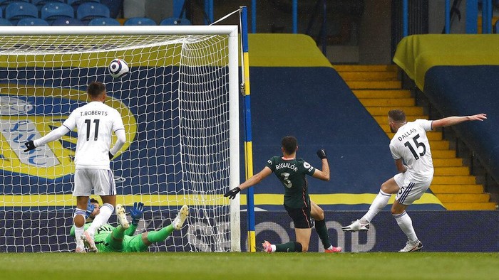 Leeds Uniteds Stuart Dallas, right, scores his teams first goal during the English Premier League soccer match between Leeds United and Tottenham Hotspur at Elland Road in Leeds, England, Saturday, May 8, 2021. (AP Photo/Jason Cairnduff/Pool)