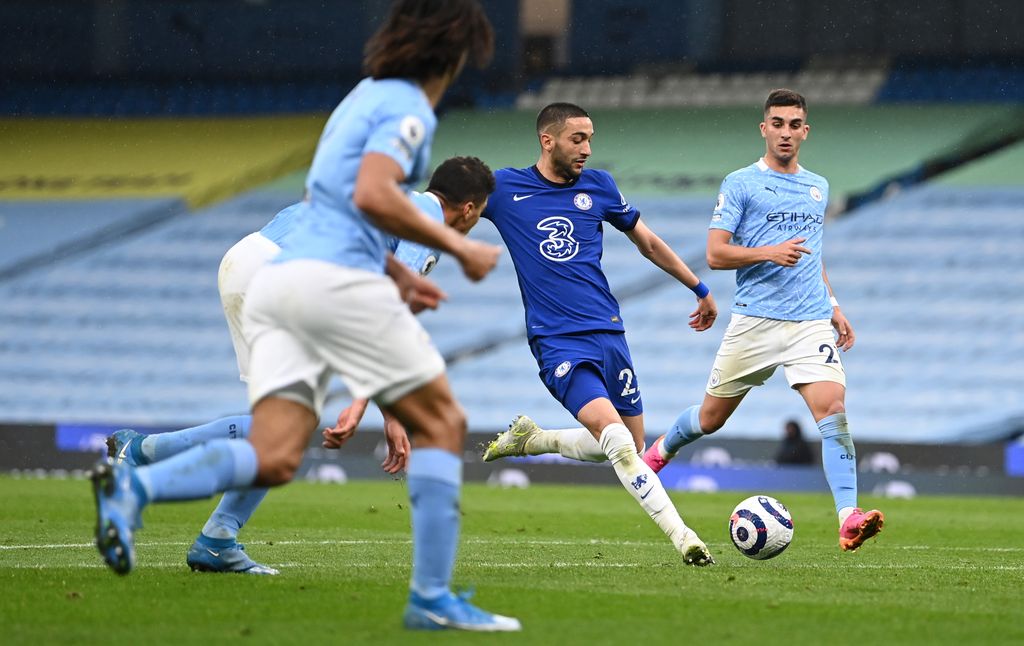 MANCHESTER, ENGLAND - MAY 08: Hakim Ziyech of Chelsea scores their side's first goal during the Premier League match between Manchester City and Chelsea at Etihad Stadium on May 08, 2021 in Manchester, England. Sporting stadiums around the UK remain under strict restrictions due to the Coronavirus Pandemic as Government social distancing laws prohibit fans inside venues resulting in games being played behind closed doors. (Photo by Shaun Botterill/Getty Images)