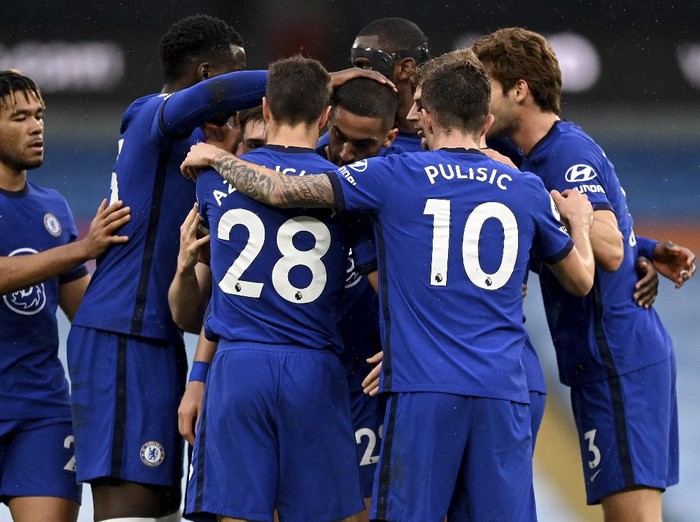 Chelsea players celebrate after scoring their side's first goal during the English Premier League soccer match between Manchester City and Chelsea at the Etihad Stadium in Manchester, Saturday, May 8, 2021.(Shaun Botterill /Pool via AP)