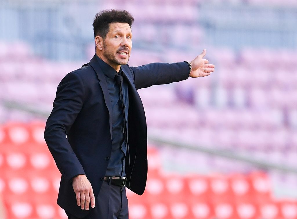 BARCELONA, SPAIN - MAY 08: Head coach Diego Pablo Simeone of Atletico de Madrid reacts during the La Liga Santander match between FC Barcelona and Atletico de Madrid at Camp Nou on May 08, 2021 in Barcelona, Spain. Sporting stadiums around Spain remain under strict restrictions due to the Coronavirus Pandemic as Government social distancing laws prohibit fans inside venues resulting in games being played behind closed doors. (Photo by David Ramos/Getty Images)