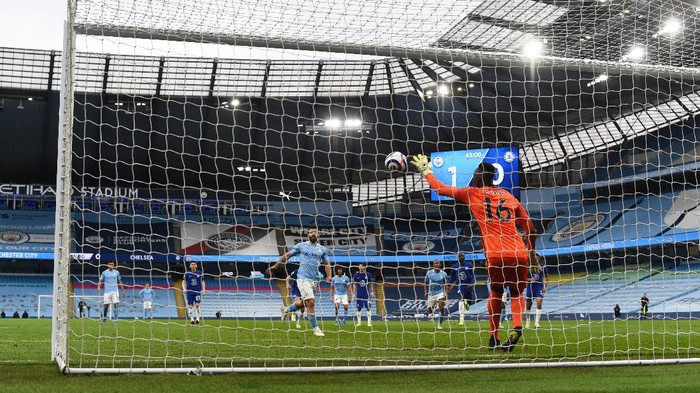 MANCHESTER, ENGLAND - MAY 08: Edouard Mendy of Chelsea saves a penalty taken by Sergio Aguero of Manchester City during the Premier League match between Manchester City and Chelsea at Etihad Stadium on May 08, 2021 in Manchester, England. Sporting stadiums around the UK remain under strict restrictions due to the Coronavirus Pandemic as Government social distancing laws prohibit fans inside venues resulting in games being played behind closed doors. (Photo by Shaun Botterill/Getty Images)