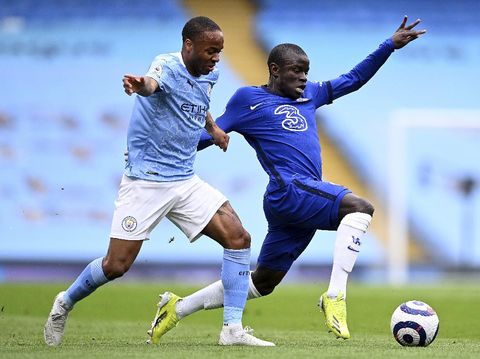 Manchester City's Raheem Sterling, left, and Chelsea's N'Golo Kante challenge for the ball during the English Premier League soccer match between Manchester City and Chelsea at the Etihad Stadium in Manchester, Saturday, May 8, 2021.(Laurence Griffiths/Pool via AP)