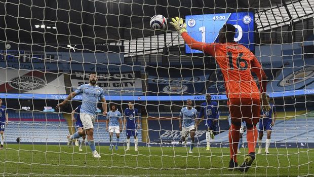 Chelsea's goalkeeper Edouard Mendy saves a penalty shot by Manchester City's Sergio Aguero, left, during the English Premier League soccer match between Manchester City and Chelsea at the Etihad Stadium in Manchester, Saturday, May 8, 2021.(Shaun Botterill /Pool via AP)