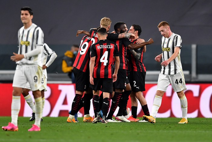 Liga Italia TURIN, ITALY - MAY 09: Ante Rebic of A.C. Milan (hidden) celebrates with team mates after scoring their side's second goal during the Serie A match between Juventus and AC Milan at on May 09, 2021 in Turin, Italy. Sporting stadiums around Italy remain under strict restrictions due to the Coronavirus Pandemic as Government social distancing laws prohibit fans inside venues resulting in games being played behind closed doors. (Photo by Valerio Pennicino/Getty Images)