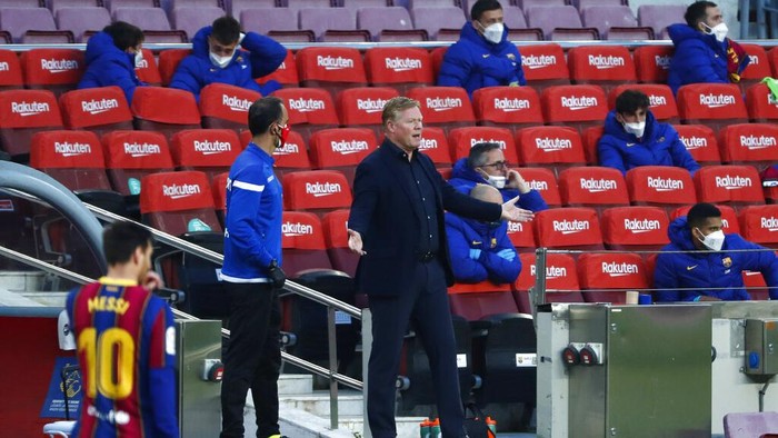 Barcelonas head coach Ronald Koeman gestures during the Spanish La Liga soccer match between FC Barcelona and Granada at the Camp Nou stadium in Barcelona, Spain, Thursday, April 29, 2021. (AP Photo/Joan Monfort)