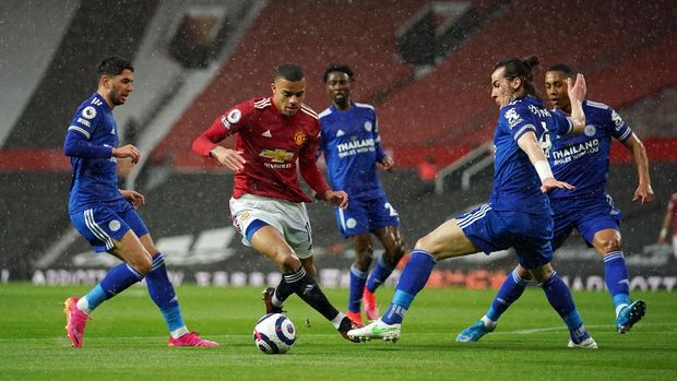 Soccer Football - Premier League - Manchester United v Leicester City - Old Trafford, Manchester, Britain - May 11, 2021 Manchester United's Mason Greenwood in action before scoring their first goal Pool via REUTERS/Dave Thompson EDITORIAL USE ONLY. No use with unauthorized audio, video, data, fixture lists, club/league logos or 'live' services. Online in-match use limited to 75 images, no video emulation. No use in betting, games or single club /league/player publications.  Please contact your account representative for further details.