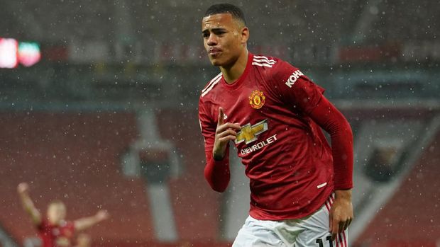 Soccer Football - Premier League - Manchester United v Leicester City - Old Trafford, Manchester, Britain - May 11, 2021 Manchester United's Mason Greenwood celebrates scoring their first goal Pool via REUTERS/Dave Thompson EDITORIAL USE ONLY. No use with unauthorized audio, video, data, fixture lists, club/league logos or 'live' services. Online in-match use limited to 75 images, no video emulation. No use in betting, games or single club /league/player publications.  Please contact your account representative for further details.