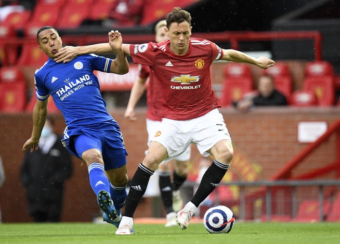 Manchester Uniteds Nemanja Matic, right, duels for the ball with Leicesters Youri Tielemans during the English Premier League soccer match between Manchester United and Leicester City, at the Old Trafford stadium in Manchester, England, Tuesday, May 11, 2021. (Peter Powell/Pool via AP)