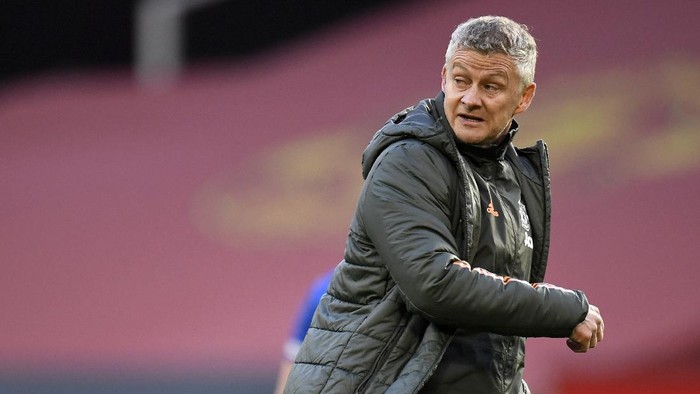 Manchester Uniteds manager Ole Gunnar Solskjaer leaves the field after the English Premier League soccer match between Manchester United and Leicester City, at the Old Trafford stadium in Manchester, England, Tuesday, May 11, 2021. (Peter Powell/Pool via AP)