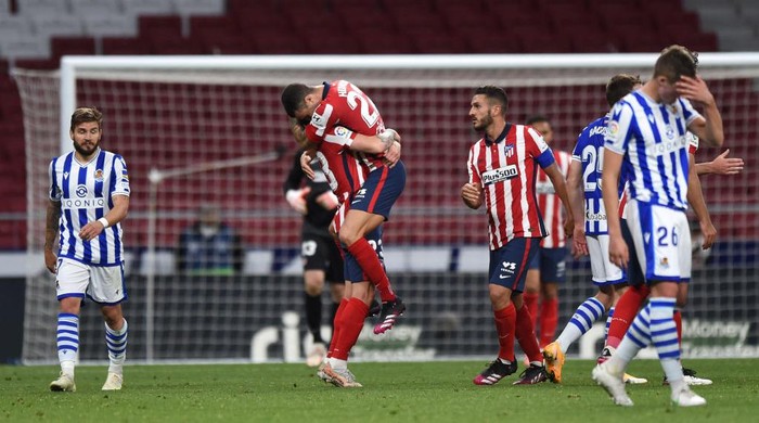 MADRID, SPAIN - MAY 12: Mario Hermoso of Atletico Madrid celebrates with a team mate during the La Liga Santander match between Atletico de Madrid and Real Sociedad at Estadio Wanda Metropolitano on May 12, 2021 in Madrid, Spain. Sporting stadiums around Spain remain under strict restrictions due to the Coronavirus Pandemic as Government social distancing laws prohibit fans inside venues resulting in games being played behind closed doors. (Photo by Denis Doyle/Getty Images)