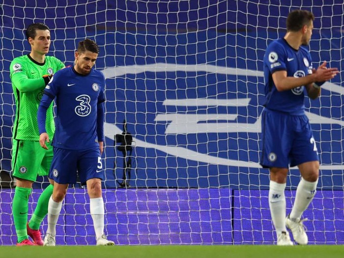 LONDON, ENGLAND - MAY 12: Kepa Arrizabalaga and Jorginho of Chelsea cut dejected figures as Emile Smith Rowe of Arsenal (not pictured) scores their sides first goal  during the Premier League match between Chelsea and Arsenal at Stamford Bridge on May 12, 2021 in London, England. Sporting stadiums around the UK remain under strict restrictions due to the Coronavirus Pandemic as Government social distancing laws prohibit fans inside venues resulting in games being played behind closed doors. (Photo by Catherine Ivill/Getty Images)