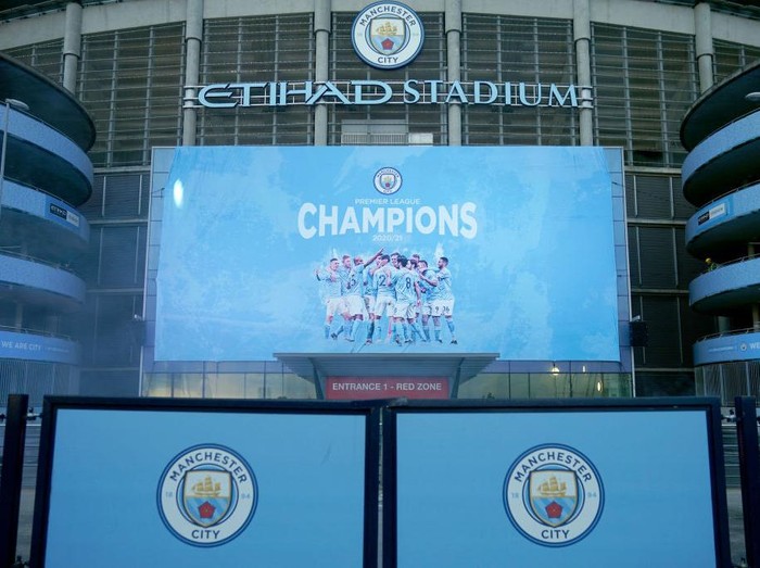 MANCHESTER, ENGLAND - MAY 11: A large display outside Etihad Stadium reads Champions as Manchester City has been confirmed as Premier League champions for the third time in four seasons on May 11, 2021 in Manchester, England. Manchester City Football club claims the Premier League title as nearest rival Manchester United lost to Leicester today 1-2. Football fans are currently unable to attend matches due to coronavirus restrictions. (Photo by Christopher Furlong/Getty Images)