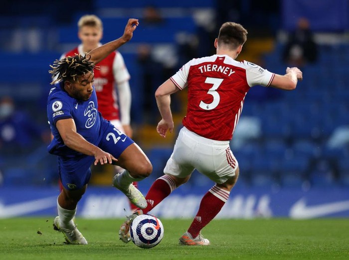 LONDON, ENGLAND - MAY 12: Reece James of Chelsea battles for possession with Kieran Tierney of Arsenal during the Premier League match between Chelsea and Arsenal at Stamford Bridge on May 12, 2021 in London, England. Sporting stadiums around the UK remain under strict restrictions due to the Coronavirus Pandemic as Government social distancing laws prohibit fans inside venues resulting in games being played behind closed doors. (Photo by Catherine Ivill/Getty Images)